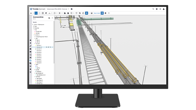 A desktop monitor displays Trimble Connect2Fab software.