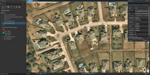 Aerial view of suburban homes with AI-generated building outlines in GIS software.